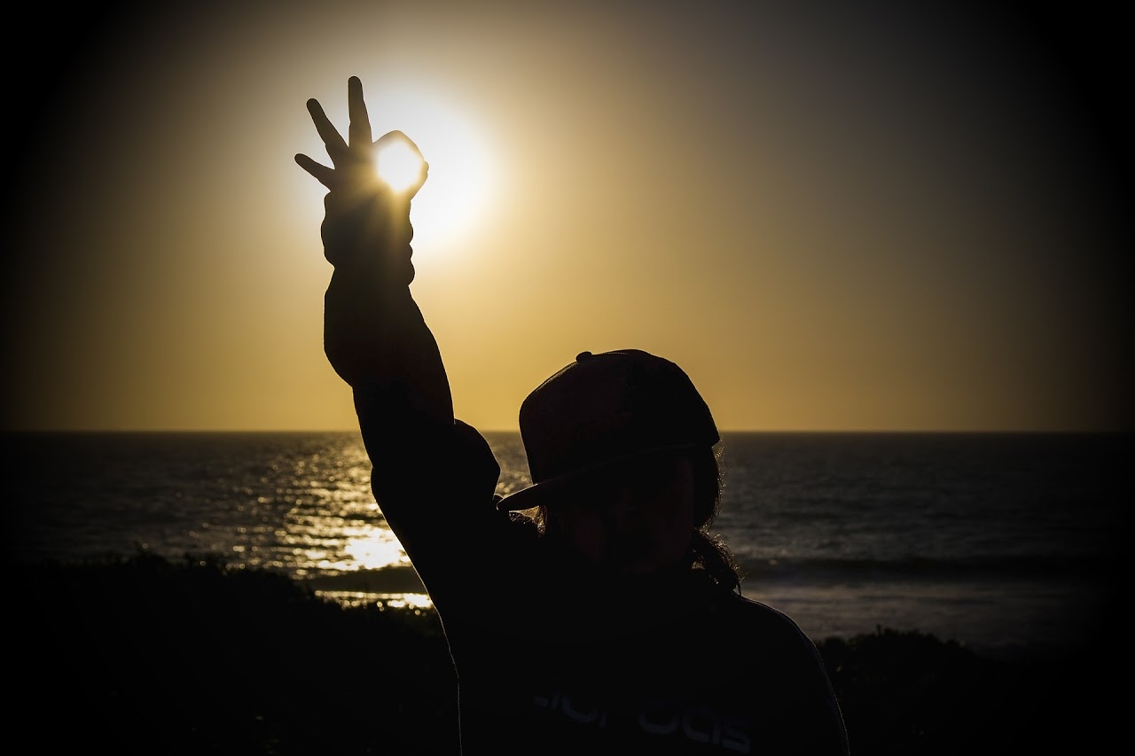 Person holding hand up to the sun - Communication in Relationships